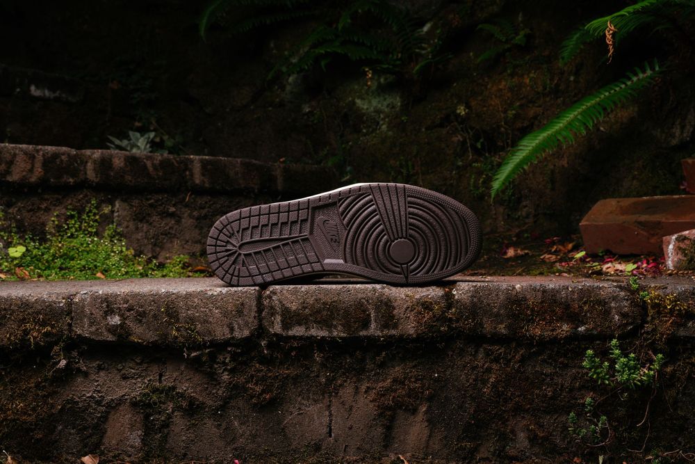 Semelle usée d'une chaussure de course, vue de dessous